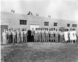 Charles Casassa, S.J., with physical plant staff and service staff