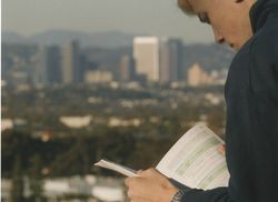 Student reading on the bluff