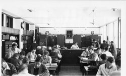 Dorothy O'Malley and students in library