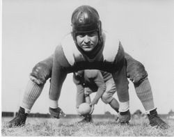 Loyola football players in action