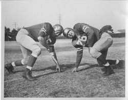 Two football players crouching