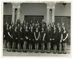 Belles group portrait in front of Sacred Heart Chapel