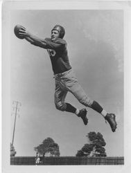 Loyola football player catching ball