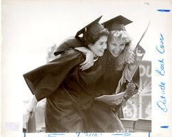 Students hugging at Loyola Marymount University commencement, 1986