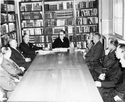 Charles Casassa, S.J., in Board meeting