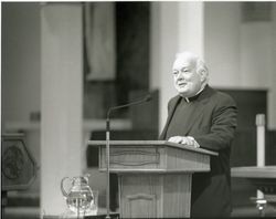 Thomas P. O'Malley, S.J., at lectern in Sacred Heart Chapel