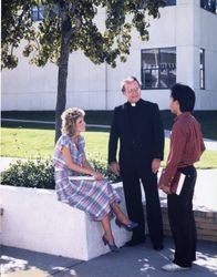 James N. Loughran, S.J. with two students