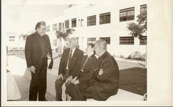 James N. Loughran, S.J., Mr. and Mrs. Jerome Doolan, and Charles S. Casassa, S.J. in front of Doolan Hall