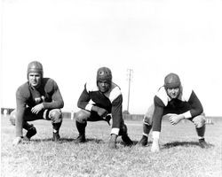 Three football players