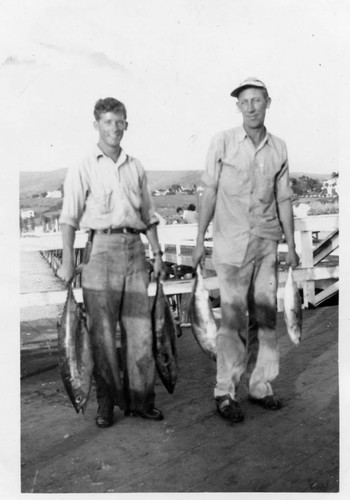 Jack Lashbrook and friend with fish, worked as deck hands on boats