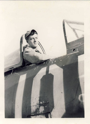 PFC Donald Larson sitting in the cockpit of a F4U-4 Corsair Marine fighter jet, MCAS El Toro, 1947