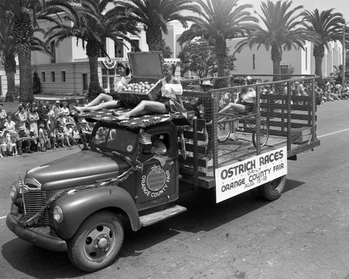 Orange County Fair ostrich racing promotion truck in the Huntington Beach Fourth of July parade, 1951