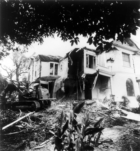 Irvine Ranch house rear view with construction and bulldozer