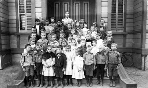 Mrs. McCharles and her grammar school class on the steps of the Tustin Public School, ca. 1900