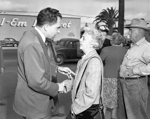 Richard M. Nixon buttonholes an Orange County voter during his 1950 U.S. Senate campaign, April 28, 1950