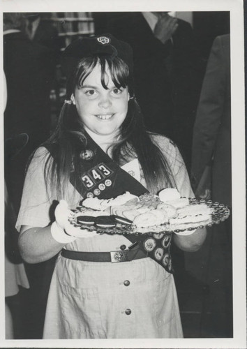 Girl Scout with cookie tray at Stanton Library event