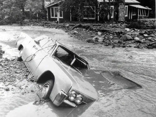 Doc. Smith's car in front of Shady Brook Market, 1969 flood