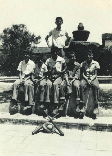 Mission School baseball team posed in front of Mission San Juan Capistrano