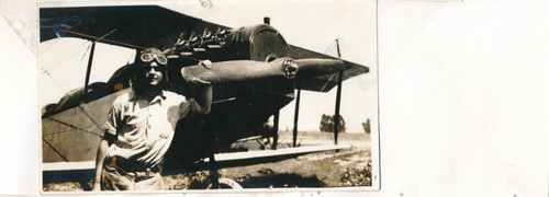 Gerald Price, age 18, with world's largest plane, Westminster, 1927