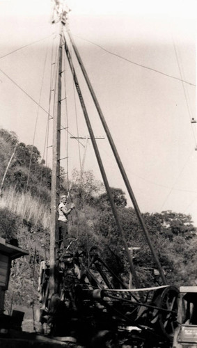 Alice Chandler helping Mr. Smith drill a well on Chandler Ranch