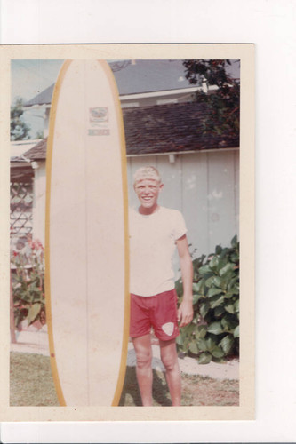 Jeff Quam with his Hobie surfboard