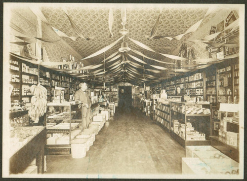 Interior view of Lee’s Grocery in Orange at Christmas, ca. 1920