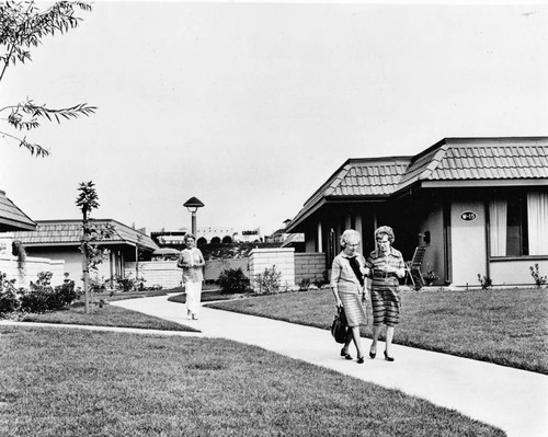 Three women walking on Leisure World sidewalk