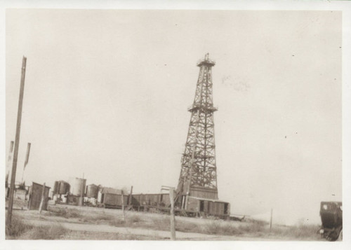 Oil well at the corner of Orange Avenue and Walker Street, ca. 1910, on Wicker family property, Cypress