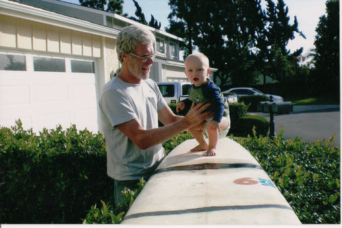 Surfer Jeff Quam with his grandson, Kingston