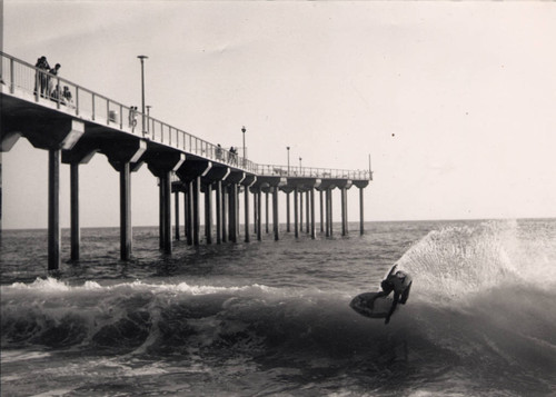 Skimboarder at Aliso Pier