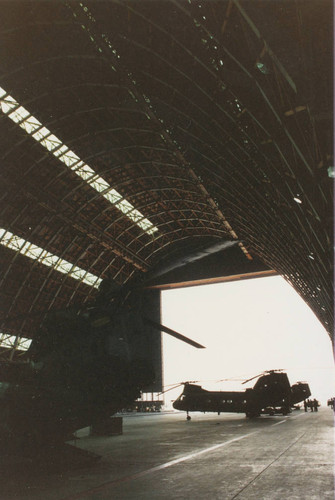 CH-46 Sea Knight helicopter framed in one of the hangars at MCAS Tustin, 1977