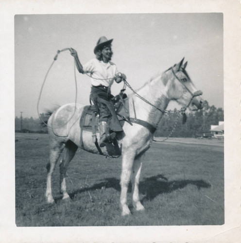 Alice Chandler on horseback with lasso