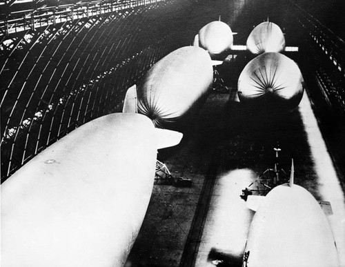 Six airships (blimps) in the new hangars, Lighter Than Air (LTA) Base, Tustin, December 1942