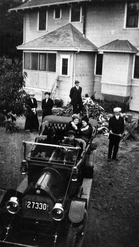 Shatto family with their REO automobile at the rear of 200 S. "A" Street, Tustin, ca. 1920