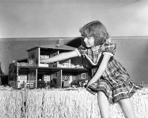 Young girl with dollhouse entry, Huntington Beach Doll Show, January 13, 1951