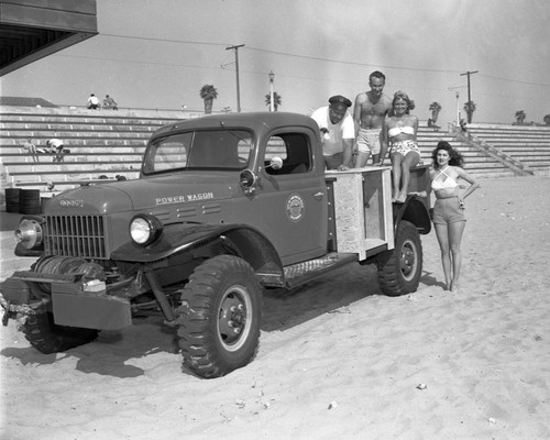 City of Huntington Beach lifeguards and truck, Huntington Beach, California, April 1947