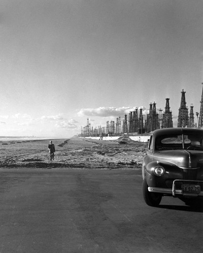 Oil well derricks on the Huntington Beach Strand, February 6, 1951