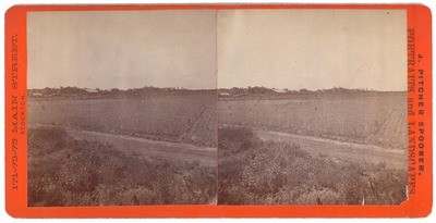 Stockton: (Field, road, barn in distance.)