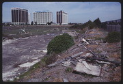 APR88P08-27: Mudflats detritus post marsh clean up, Holiday Inn, Komatsu