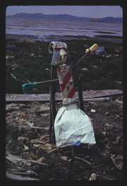 APR74P6-28: figure sculpture with manure bag skirt, By RS