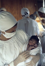 Judy Ijames with infant Camella Griffith, The First Child Born in Jonestown Medical Clinic, Jonestown, Guyana