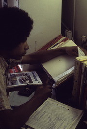 Peoples Temple Member Mark Boutte Studying Auto Repair, San Francisco, California (?)