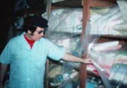 [Jim Jones showing supplies and provisions in the Jonestown warehouse]