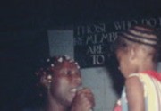 [Jonestown residents entertaining in pavilion]