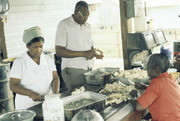 Irene (Left) and James Edwards (Center) Preparing Food Jonestown, Guyana