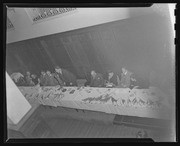 David Jenkins standing at speakers table at W. E. B. Du Bois Banquet, California Labor School