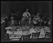 Musicians serenading Henry Wallace and diners, California Labor School