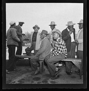 Men gathered around waterfront dock, California Labor School