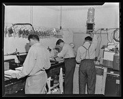 Photography students working in darkroom, California Labor School