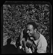 Joe Johnson playing guitar, California Labor School